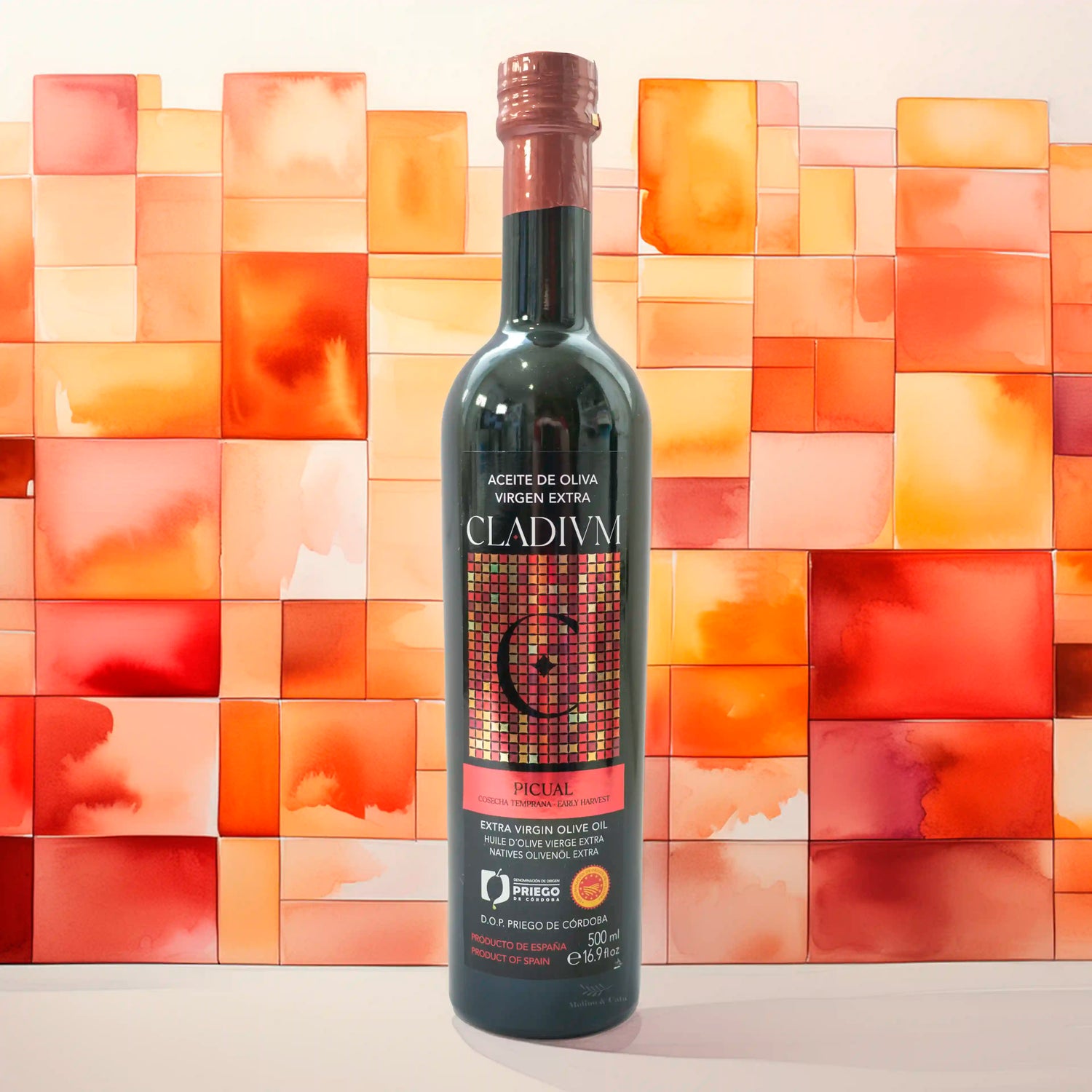 Aceite de Oliva Virgen Extra Cladivm Picual 500ml con fondo decorativo inspirado en la botella